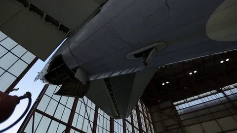 Airplane in hanger Stock Footage 77129439