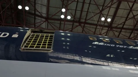 Airplane in hanger Stock Footage 77129441