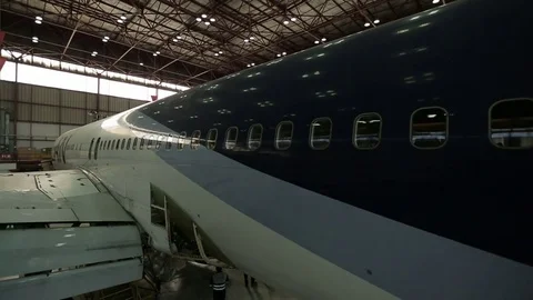 Airplane in hanger Stock Footage 77129448