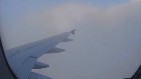 Airplane Interior View of Clouds Through Jet Window Stock Footage 101641620