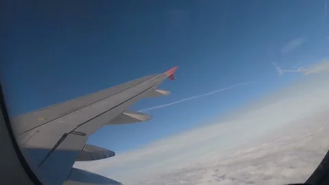Airplane Interior View of Clouds Through Jet Window Stock Footage 101641657