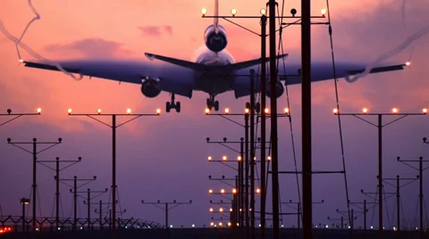 Airplane jet plane landing in airport at dusk. Slow motion. Stock Footage 35522606