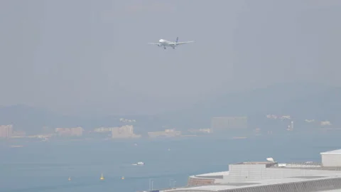 Airplane landing approach from far Stock Footage 248035461