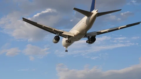 Airplane is landing back view. Plane at ... | Stock Video | Pond5