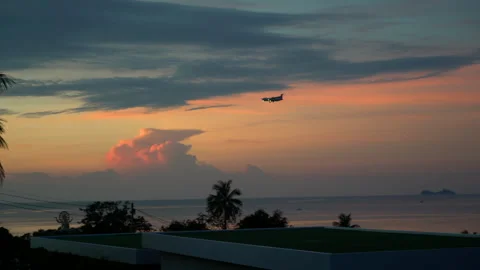 Airplane landing on the background of sunrise. dramatic sky. Aircraft departure Stock Footage 256794009