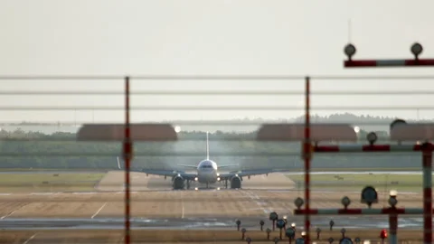 Airplane landing in backlight Stock Footage 172414206