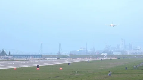 Airplane Landing on a Cloudy Day Stock Footage 127869596