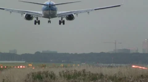 Airplane landing at dusk Stock Footage 11916397