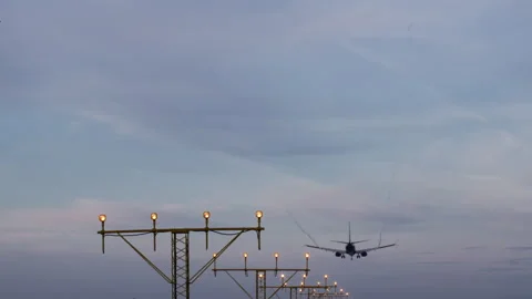 The airplane is landing at dusk Stock Footage 273313778