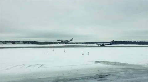 Airplane is landing in a slow motion in winter Stock Footage 59574329