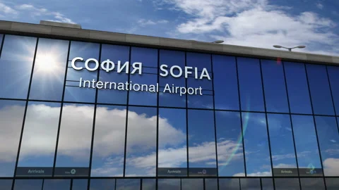 Airplane landing at Sofia mirrored in terminal Vidéo 127743241