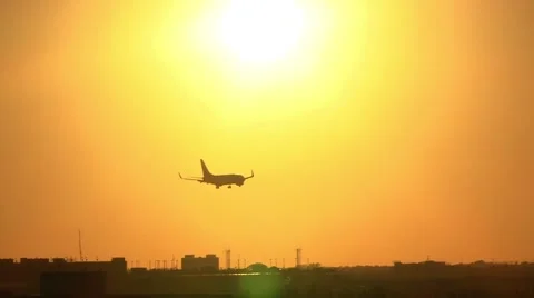 Airplane landing at sunset Stock Footage 40580130