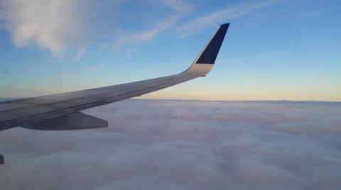 Airplane landing through the clouds Stock Footage 62514627