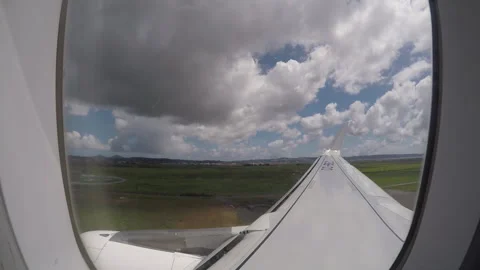 Airplane Landing View with Clouds and Wing Stock Footage 306767186