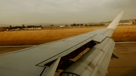 Airplane landing. window view. runway. plane wing Stock-Footage 40671622