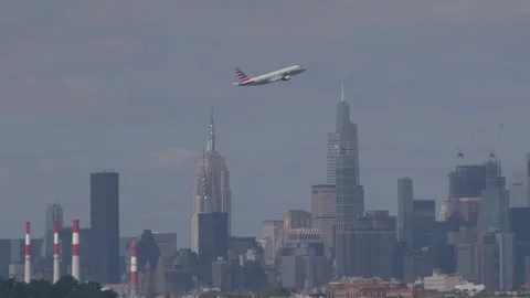 Airplane leaving flying New York City sk... | Stock Video | Pond5