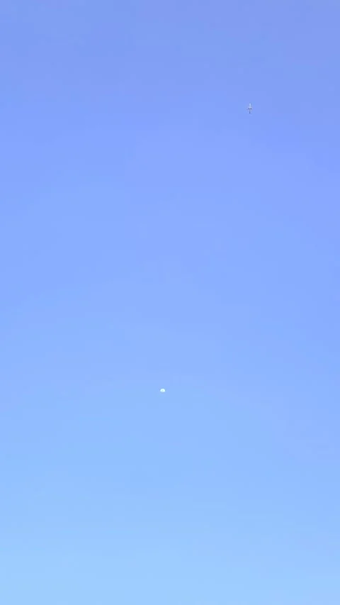 Airplane Leaving the Moon, Vertical 4k Footage Video stock 337566234