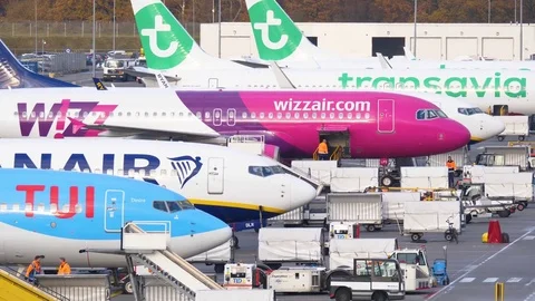 Airplane line up at parking stand Stock Footage 84425892