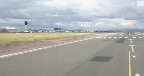 An airplane lines up at the end of the r... | Stock Video | Pond5