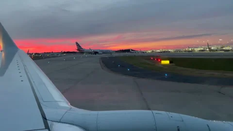 Airplane making a landing at sunset Stock-Footage 163942940