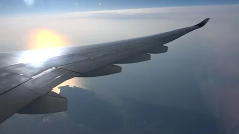 The airplane is making a turn, leaving the coastline behind Stock Footage 282322950