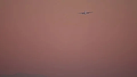 Airplane making a turn in the sky seconds after takeoff Stock Footage 121355823