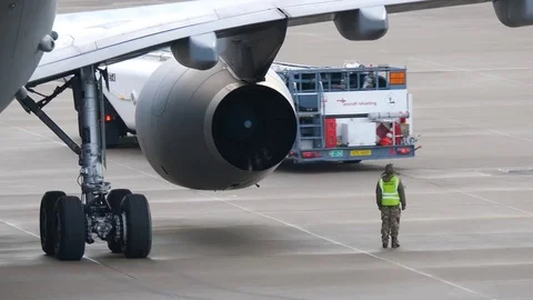 Airplane with man inspecting Stock Footage 84424080