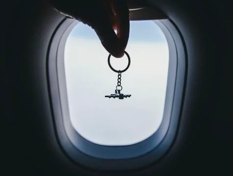 Airplane model at the airplane window background Stock Photos