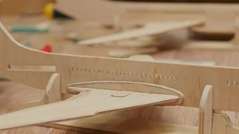 Airplane model and man hands inserting miniature details Stock Footage 127377324