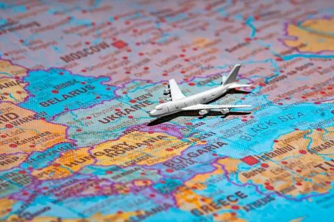 Airplane model over the map of Ukraine representing air travel and airspace s Fotos Stock