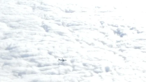 Airplane moving above clouds wide shot Stock Footage 98615090