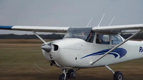 A airplane is moving across the field. Stock-Footage 274095060