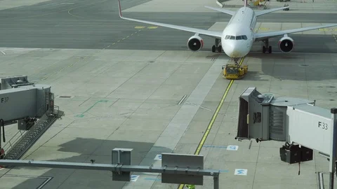 Airplane Moving at Airport Dock. Gate Terminal View Stock Footage 107534963