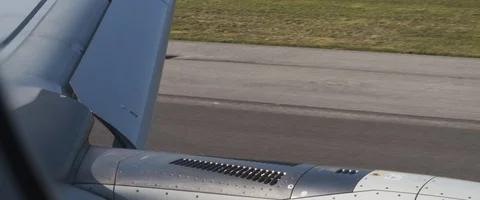 Airplane moving on the runway during take off, view from the window Stock Footage 127135670