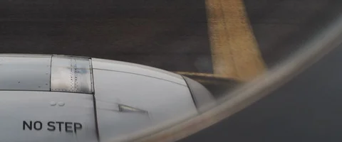 Airplane moving on the runway during take off, view from the window. Stock Footage 127135938