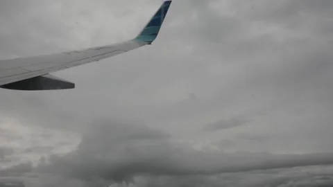 Airplane moving under the thick clouds Stock Footage 198992062