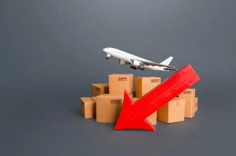 Airplane over boxes and red down arrow. Decline of goods transportation vol.. Stock Photos