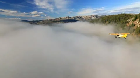 Airplane over clouds Stock Footage 10703131