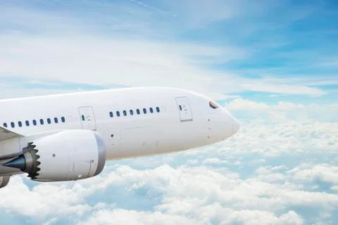 Airplane over clouds Stock Photos