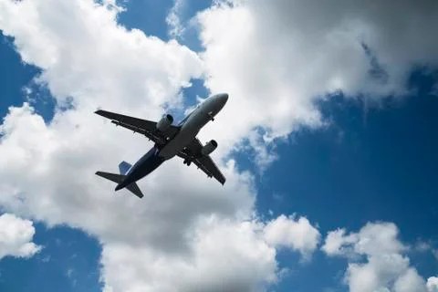 Airplane over the clouds 库存照片