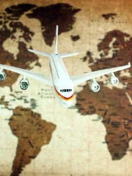 Airplane over world map Stock Photos