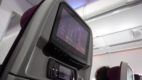 Airplane Passenger Interacts With Touch Screen 動画素材 94425509