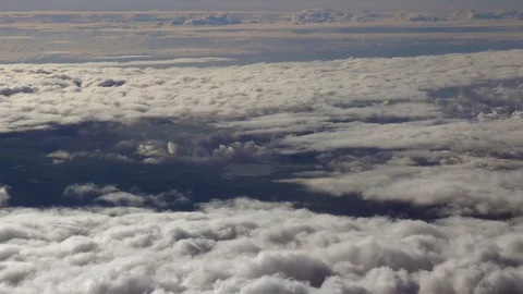 Airplane passenger POV of clouds during flight Stock Footage 100549751