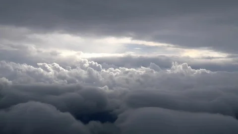 Airplane passenger POV of clouds during flight Stock Footage 100550666