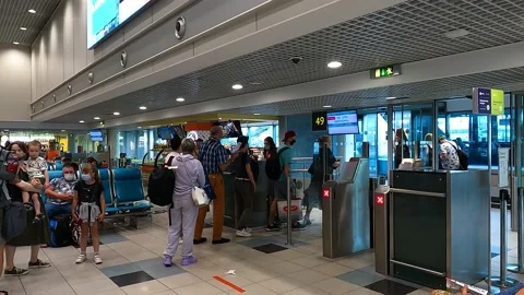 Airplane passengers go through ticket check before boarding Stock Footage 174944895