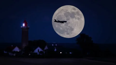 Airplane passing the full moon Stock Footage 145418527