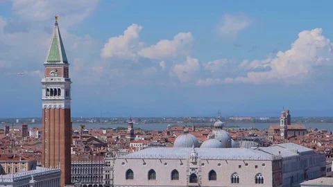 Airplane passing over Bell Tower, Venice Stock Footage 71574183