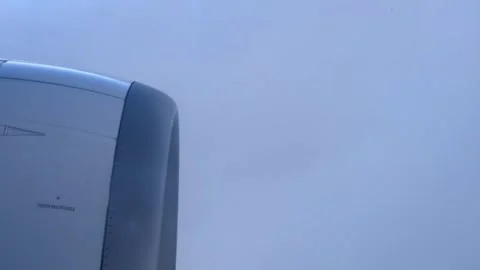 Airplane passing through a cloud Stock Footage 247144930