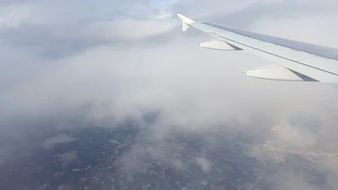 Airplane passing through the Clouds during the Landing Procedure. Stock Footage 119728557