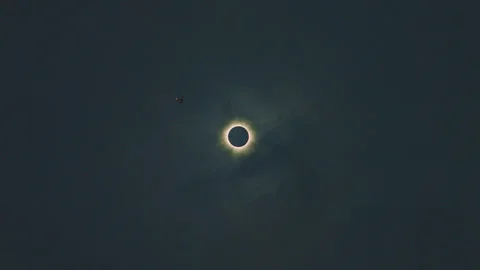 Airplane passing by Total Eclipse 2024 Stock Footage 271321252